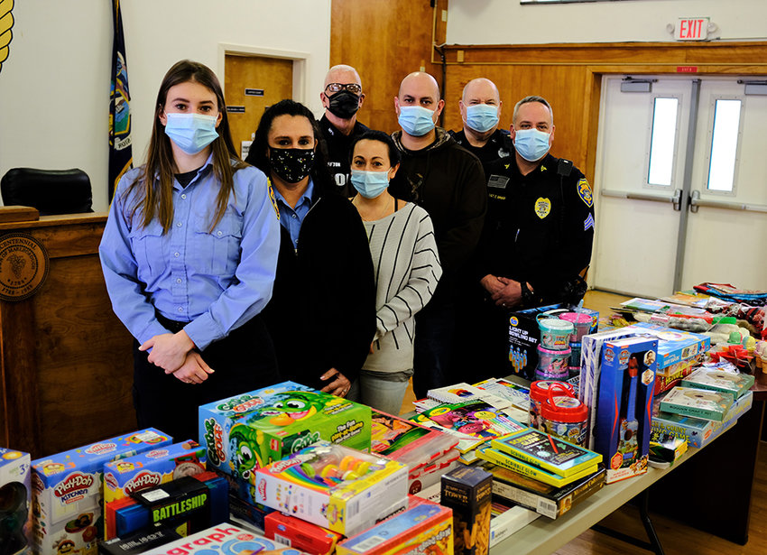 Participants in this year&rsquo;s Marlborough Police Toy Drive included [l - r] dispatcher Georgie Super, Jennifer VanAmburgh, Tina Rosa and officers Curt Fulton, Mike Sotanski, Gerard Biviano and Sgt. Chris Griggs.