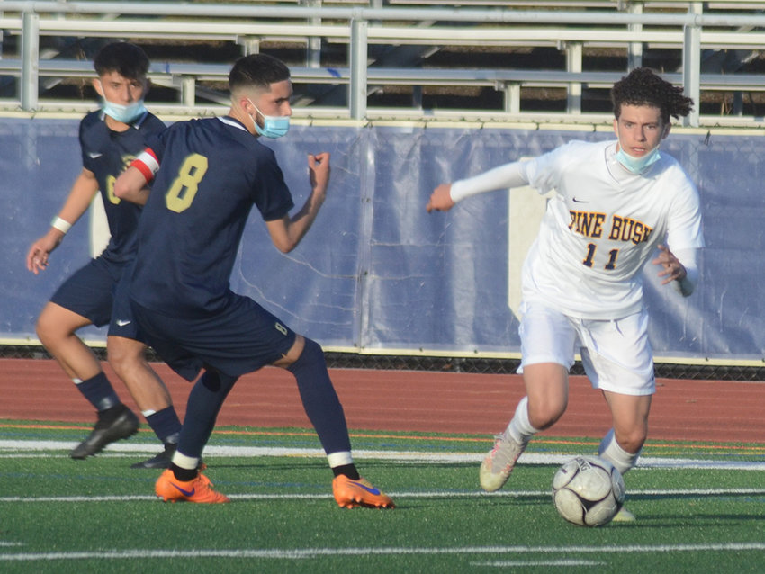 Pine Bush&rsquo;s Michael Dempsey moves the ball during Wednesday&rsquo;s OCIAA boys&rsquo; soccer game at Newburgh Free Academy.