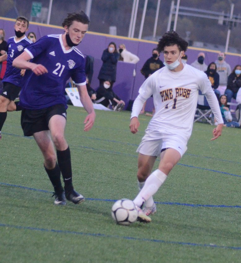 Pine Bush&rsquo;s Michael Dempsey looks to move the ball during the Section 9 Class AA finals on April 20 at Monroe-Woodbury High School in Central Valley.&nbsp;