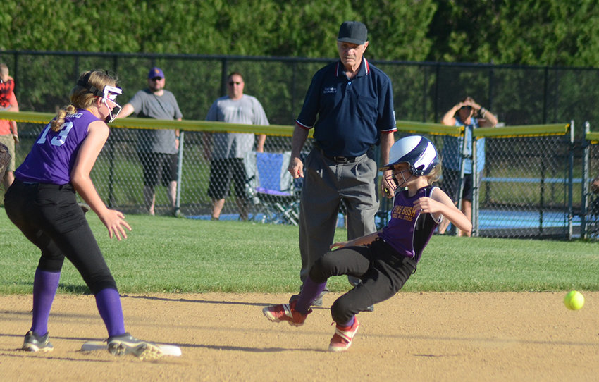 Pine Bush-Monticello&rsquo;s Amelia Bavolar slides into second base as Warwick-Greenwood Lake shortstop Emily Romig waits for the throw during Wednesday&rsquo;s District 18 major softball championship game at Pine Bush Little League field.