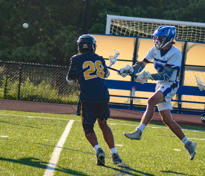 Wallkill&rsquo;s Chad Castle shoots the ball as Highland&rsquo;s Alexander Martinez defends during a Section 9 Class C boys&rsquo; lacrosse championship game at Wallkill High School, June 11.