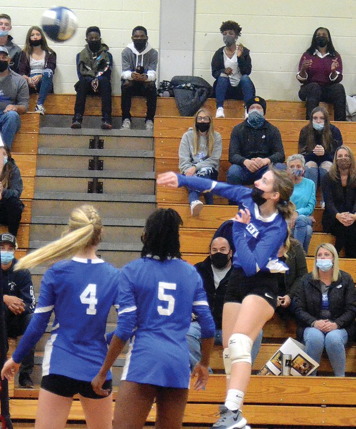 Valley Central&rsquo;s Julia Wilson hits the ball over the net as teammates Hailey Nop (4) and Bianca Staples look on during Thursday&rsquo;s Section 9 Class AA semifinal volleyball match at Pine Bush High School.