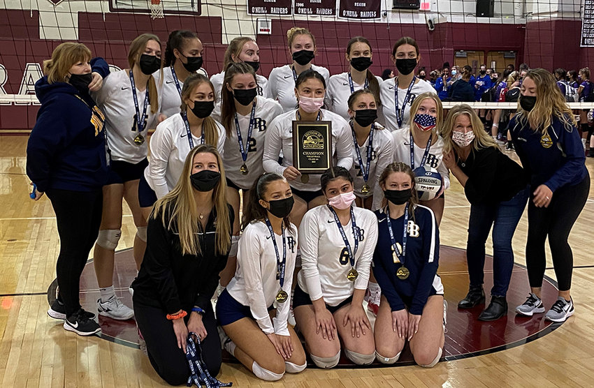 The Pine Bush volleyball team poses with the Section 9 Class AA championship plaque after Sunday&rsquo;s 3-2 win over the Monroe-Woodbury Crusaders at James I. O&rsquo;Neill High School in Highland Falls.