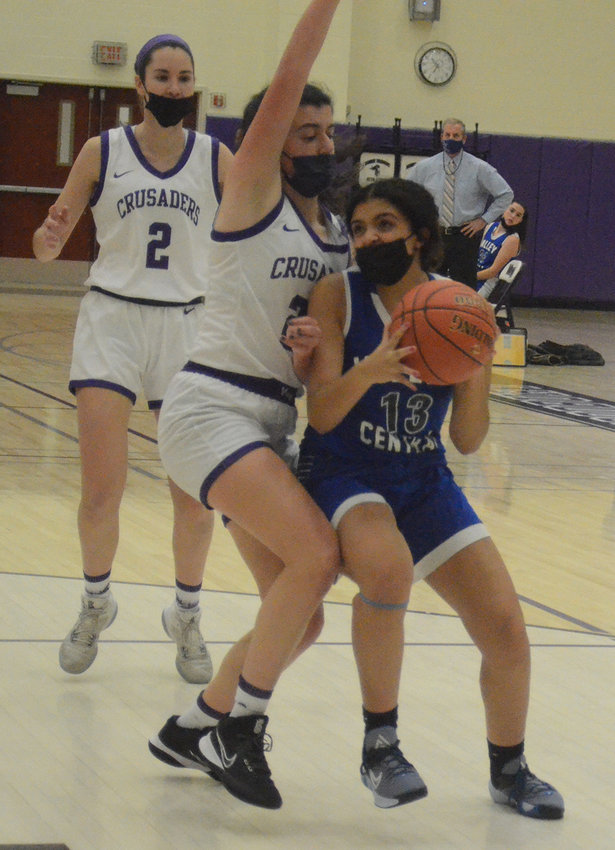 Valley Central&rsquo;s Bella Santana looks for a shot as Monroe-Woodbury&rsquo;s Lauren Morgante defends and Kera Cunningham (2) looks on during Wednesday&rsquo;s OCIAA crossover girls&rsquo; basketball game at Monroe-Woodbury High School in Central Valley.