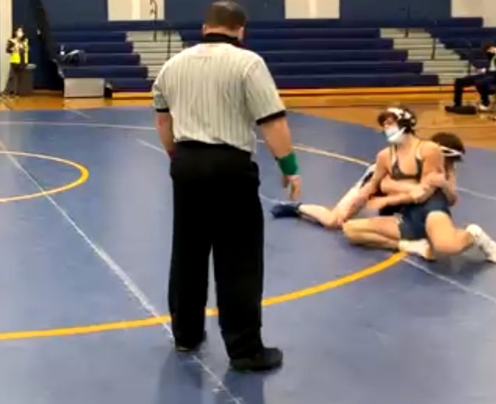Newburgh&rsquo;s Tyler Busby controls Pine Bush&rsquo;s Ethan Conrown this screenshot of a 145-pound bout at Wednesday&rsquo;s OCIAA wrestling match at Pine Bush High School. The meet was livestreamed over social media, with no spectators or media permitted inside the gym.