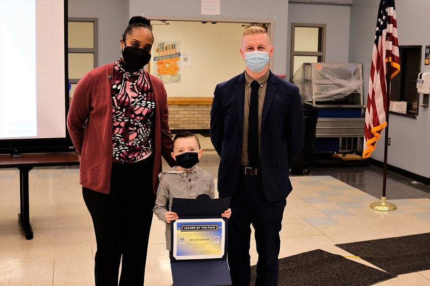 Declan Gorton was named the Leader of the Pack at the Highland Elementary School for January. L-R Asst. Principal Tulani Samuel, Declan, Principal Matthew Darling.