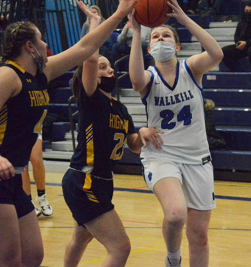 Wallkill&rsquo;s Sam Dembinski goes up for a basket as Highland&rsquo;s Alexa Pavese (21) and Kayleigh Kaplan defend during Friday&rsquo;s MHAL girls&rsquo; basketball game at Wallkill High School.&nbsp;