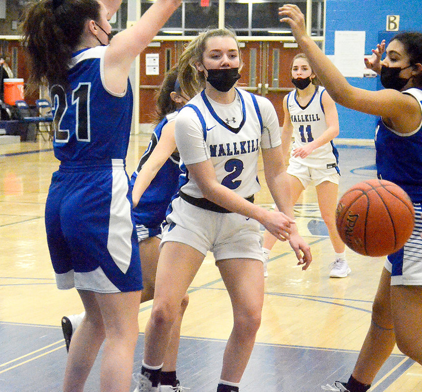 Wallkill&rsquo;s Emma Schwarzbeck passes the ball as Valley Central&rsquo;s Jenna O&rsquo;Connor (21) and Isabella Santana defend during Thursday&rsquo;s non-league girls&rsquo; basketball game at Wallkill Senior High School.&nbsp;