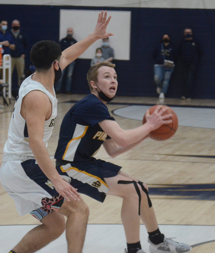 Pine Bush&rsquo;s Evan Jaloszysnki tries to shoot during Sunday&rsquo;s Section 9 Class AA semifinal boys&rsquo; basketball game at Newburgh Free Academy.