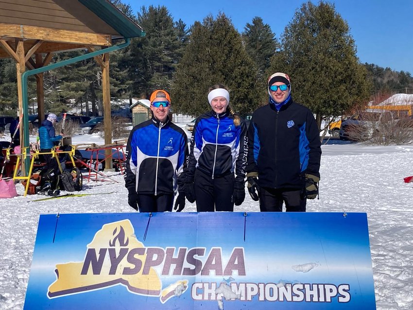 Wallkill skiers Jordan Marwin and Andie Psilopoulos pose with coach Nick Mancuso at the New York State Public High School Athletic Association Meet at Gore Mountain Ski Center.