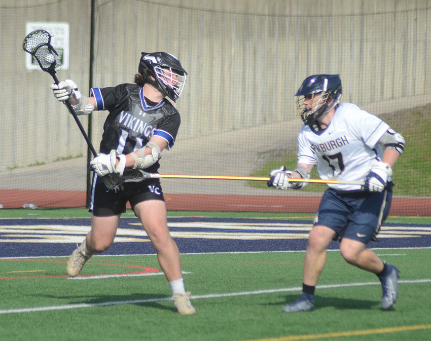 Valley Central&rsquo;s Jack Sherry moves the ball as Newburgh&rsquo;s Aiden Harrison defends during an April 5 non-league boys&rsquo; lacrosse game at Newburgh Free Academy.