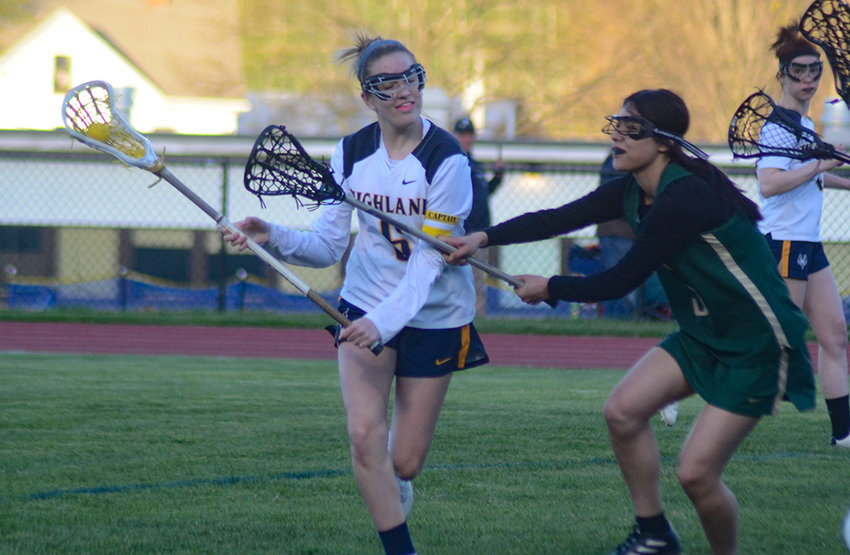 Highland&rsquo;s Leah Klotz moves the ball down the field as FDR&rsquo;s Lyanna Bates defends during Friday&rsquo;s girls&rsquo; lacrosse game at Highland High School.