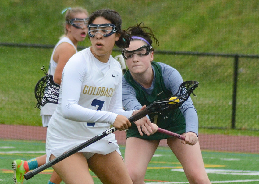 Newburgh&rsquo;s Savannah Tinsley changes direction as FDR&rsquo;s Hannah Guarino defends during Friday&rsquo;s girls&rsquo; lacrosse game at Academy Field in Newburgh.