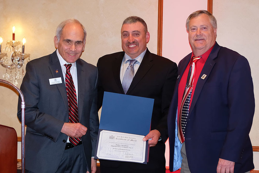James Anzalone was honored for serving the Highland Hose Company for 30 years. He is flanked by Assemblyman Jonathan Jacobson (l) and Ulster County Legislator and cousin Herb Litts.