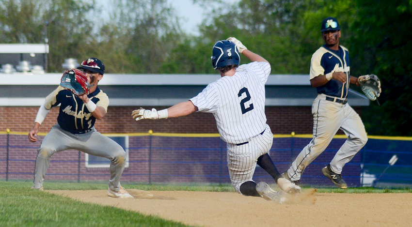 Pine Bush&rsquo;s Jack Taylor slides into second base as Newburgh second baseman Tyler Martin takes the throw and shortstop Joe Alicea looks on during Friday&rsquo;s OCIAA crossover baseball game at E.J. Russell Elementary School in Pine Bush.