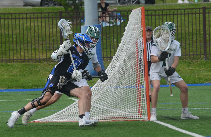 Wallkill&rsquo;s Richie Martinez takes the ball around the cage as Cornwall&rsquo;s Martin Decker and goalkeeper John Westbrook wait for a play during Saturday&rsquo;s non-league boys&rsquo; lacrosse game at Mount Saint Mary College in Newburgh.