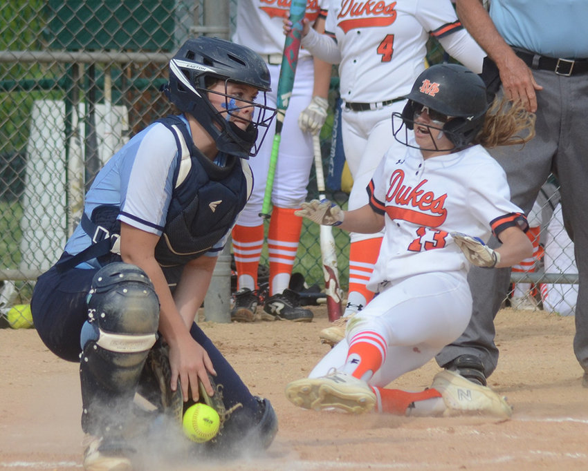 Marlboro&rsquo;s Kalista Birkenstock slides into home as Saugerties catcher Sammie Graham takes the throw during Wednesday&rsquo;s MHAL semifinal softball game at Tony Williams Park in Highland.