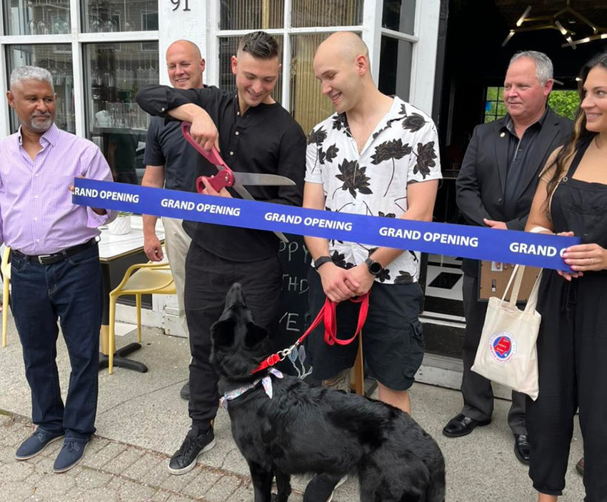 On Saturday, May 14, a special ribbon cutting ceremony was held in collaboration with the Business Council of Greater Montgomery to commemorate the official grand opening of Lady. From left to right, Lady&rsquo;s Interior Designer Dave Little, Deputy Police Chief Paul Arteta, Chef Justin and Keith Lynch with their dog and Lady&rsquo;s namesake &ldquo;Lady&rdquo;, Mayor Steve Brescia, and Elizabeth Lounsbury Sollecito on behalf of the Business Council of Greater Montgomery.