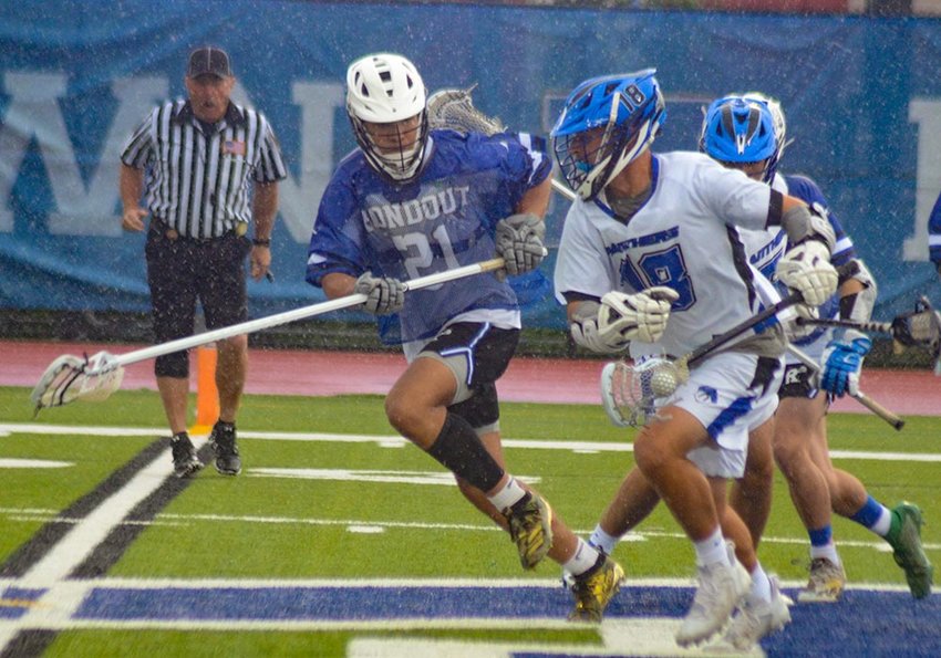 Wallkill&rsquo;s Austin Palen takes the ball across midfield as Rondout Valley&rsquo;s Tyson Meade defends during the Section 9 Class C boys&rsquo; lacrosse championship game on Saturday.