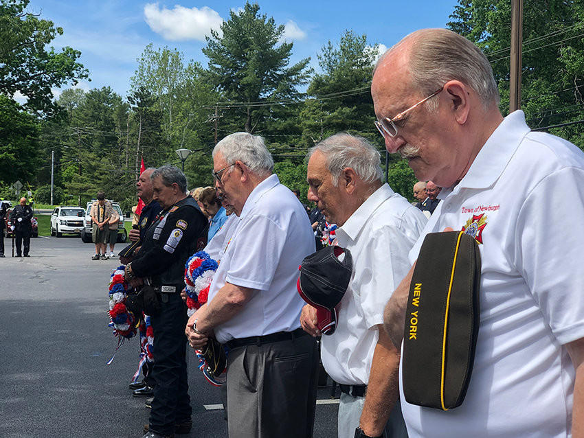 Veterans removed their caps for a brief moment of prayer.