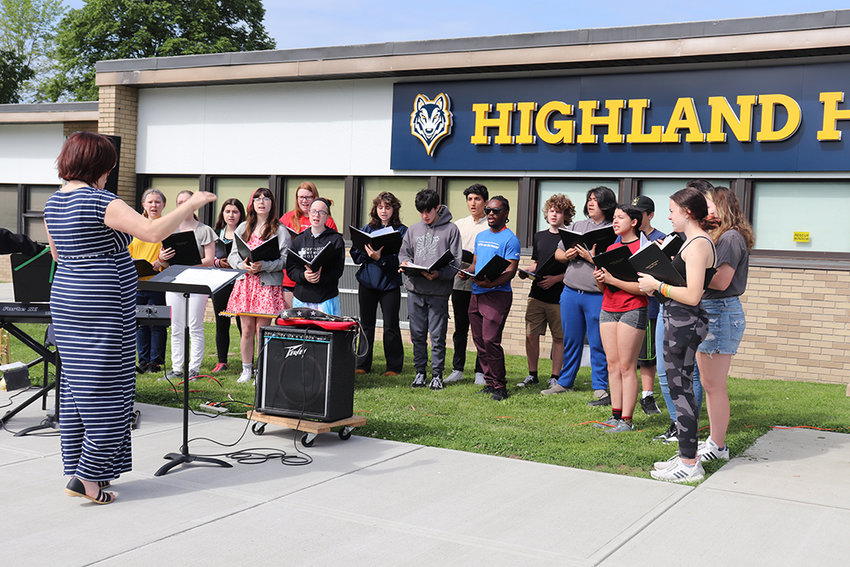 The Highland High School Choir performs a patriotic medley during the school&rsquo;s Memorial Day assembly on May 25.