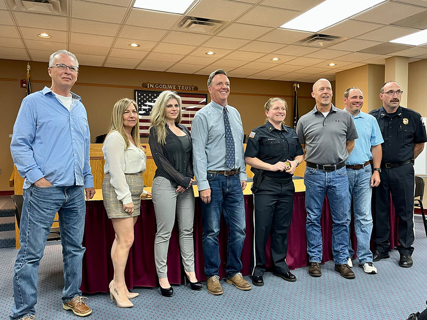 Christie Meany with the Crawford Town Board after being promoted. From left to right: Councilman Rory Holmes, Town Clerk Jessica Kempter, Councilwoman Angelina Jadrossich, Town Supervisor Charles Carnes, Sgt. Christie Meany, Deputy Supervisor Mike Menendez, Councilman Jason Muehr, and Crawford Police Chief Dominick Blasko.