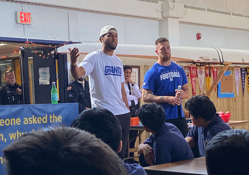 New York Giants Collin Johnson and Carter Coughlin speaking to the San Miguel Academy student body.
