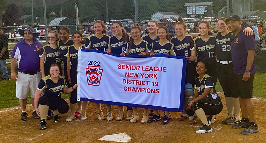 The Pine Bush Senior Softball team poses with the District 19 championship banner after beating Cornwall on June 28 at Crawford Town Park in Pine Bush.