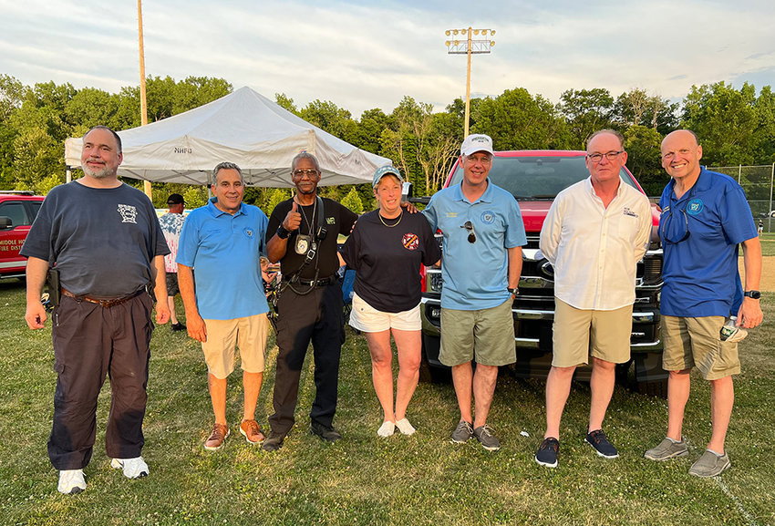 Councilman Paul Ruggiero, Councilman Anthony LoBiondo, New York State Senate candidate Rob Rolison and Councilman Scott Manley celebrate Community Day with several members of the various fire departments in the town.
