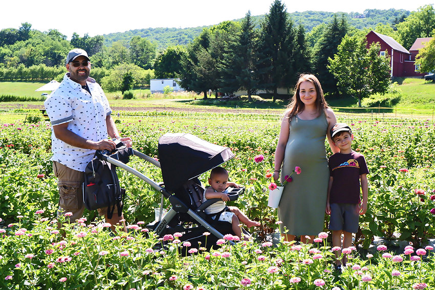 The Flores family of Wallkill, picking flowers and enjoying the sun.