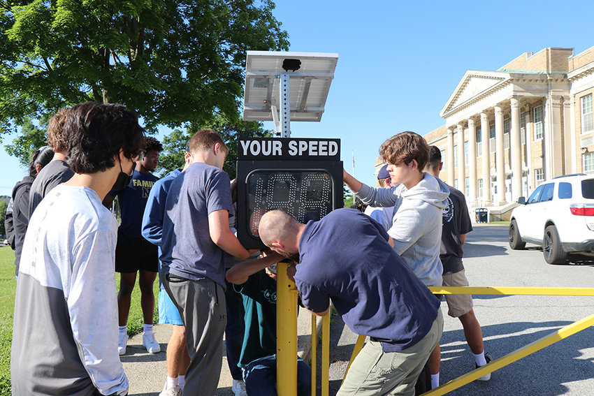 Students retrofit a speedometer with solar panels.
