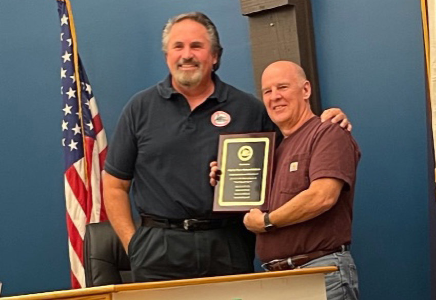 Maybrook Mayor Dennis Leahy (l.) presents Deputy Mayor Robert Pritchard (r.) with a plaque from the Village Board at last week&rsquo;s  meeting in appreciation for his many years of service to the village.