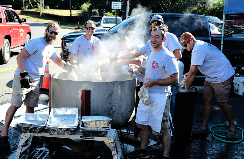 At the clam steaming pot at the recent Milton Lobster and Clam Bake were (l. &ndash; r.) Jason Irhig, Nick Lofaro, Kyle Harney (front), Anthony Primavera and Alex Winterleiner.