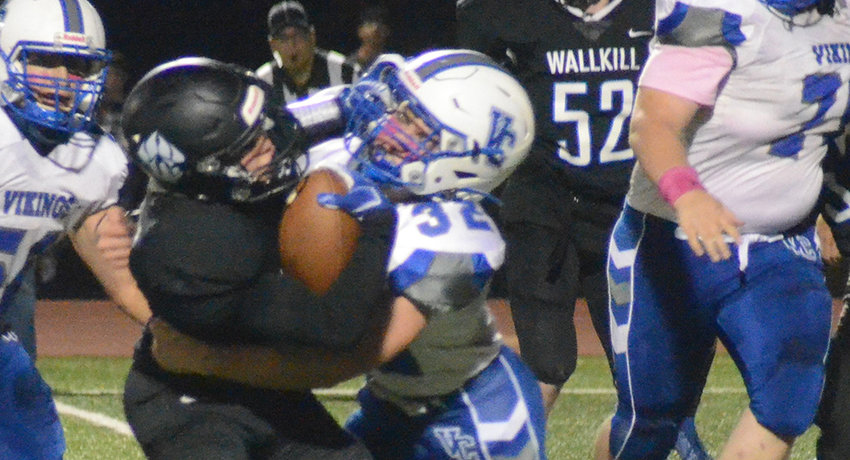 Wallkill&rsquo;s Mason Ondreyko runs the football as he is tackled by Valley Central&rsquo;s Daniel Latimer during a football game on Oct. 15, 2021, at Wallkill High School.