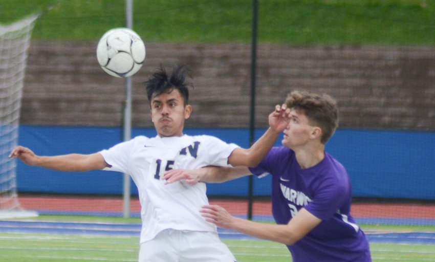 Newburgh&rsquo;s Steven Hernandez heads the ball away from Warwick&rsquo;s Harrison Coard during a Section 9 Class AA boys&rsquo; soccer championship game on Oct. 30, 2021, at Faller Field in Middletown.
