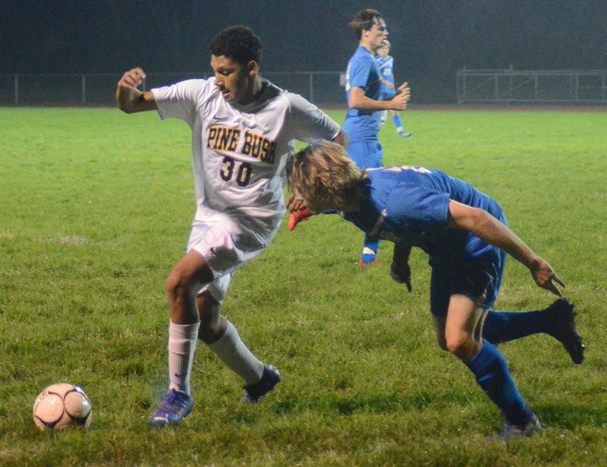 Pine Bush&rsquo;s Imanol Florez tries to keep the ball away from Valley Central&rsquo;s Sebastien Rockwood during an Oct. 25, 2021, Section 9 Class AA quarterfinal boys&rsquo; soccer game at Valley Central High School.