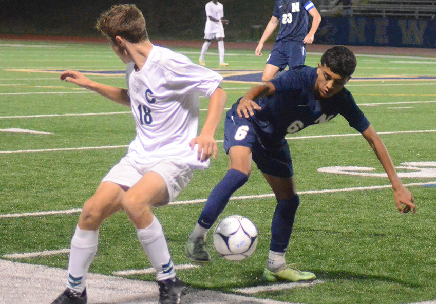 Newburgh&rsquo;s Anthony Martinez maneuvers the ball away from Cornwall&rsquo;s Alex Sawyer during Wednesday&rsquo;s non-league boys&rsquo; soccer game at Newburgh Free Academy.