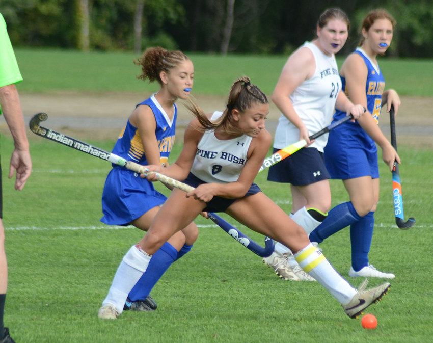 Pine Bush&rsquo;s Jennifer Sorrentino takes a shot on goal as Ellenville&rsquo;s Sarai Cruz defends and Pine Bush&rsquo;s Leah O&rsquo;Donnell (21) and Ellenville&rsquo;s Isabella Elias look on during a MHAL field hockey game on Sept. 12 at Pine Bush Elementary School.