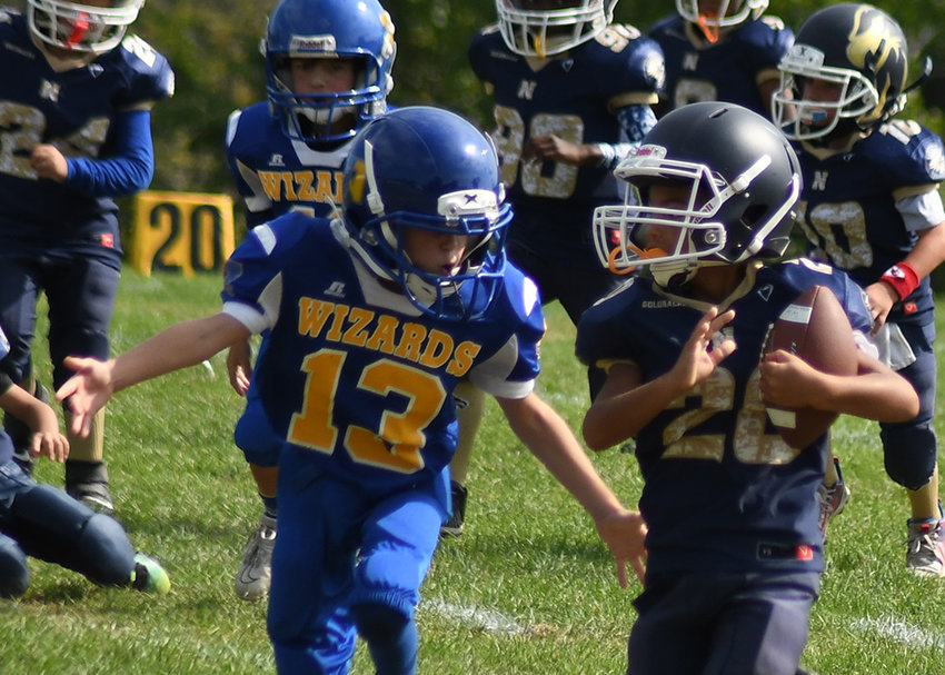 Newburgh Goldbacks&rsquo; Aaidyn Diaz runs the football during Saturday&rsquo;s Orange County Youth Football League Mighty Mites football game at Lasser Park in Salisbury Mills.