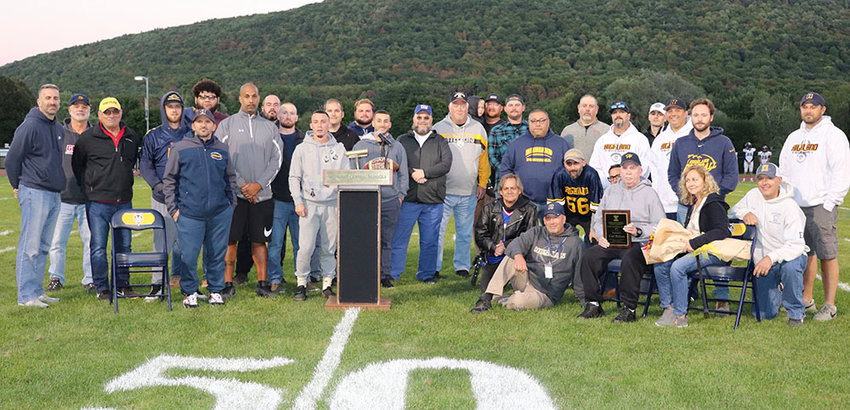 Highland High School Varsity Football coaches and former players came together to celebrate a &ldquo;Night of Champions&rdquo; on September 23. The guest of honor was Coach Carl Relyea (seated, with plaque), who led the Husky team from&nbsp;1986 to 2015.