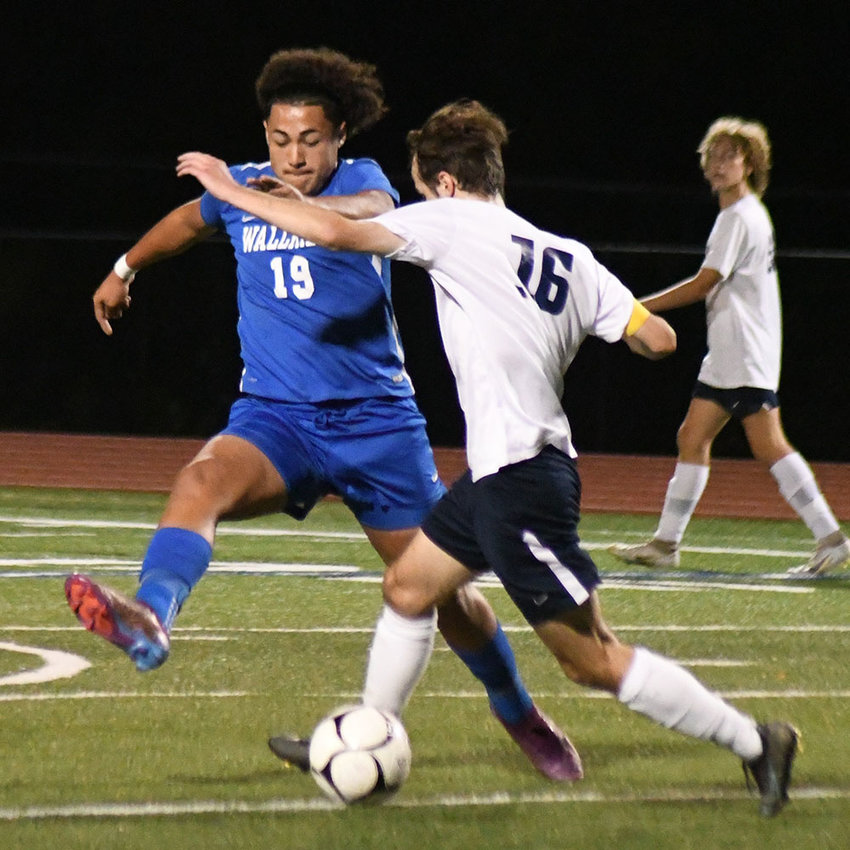 Wallkill&rsquo;s Chris Banegas kicks the ball past a Saugerties player during Thursday&rsquo;s MHAL boys&rsquo; soccer game at Wallkill Senior High School.