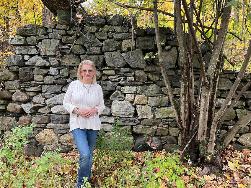 Susan Cockburn on her Montgomery property that includes ruins of an old paper mill.