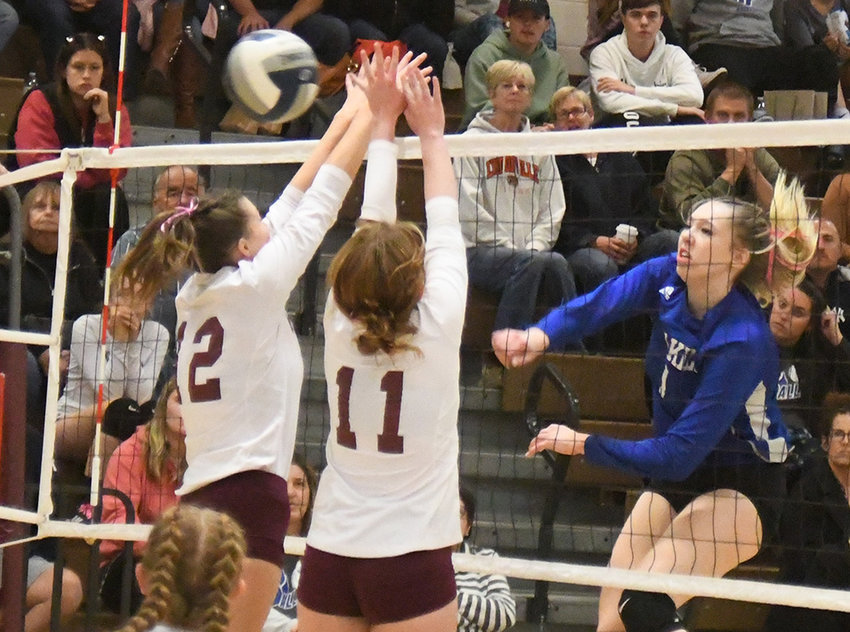 Wallkill&rsquo;s Regan Moyekens sends the ball over the net past two New Paltz defenders during Thursday&rsquo;s MHAL Division I volleyball game at New Paltz High School.