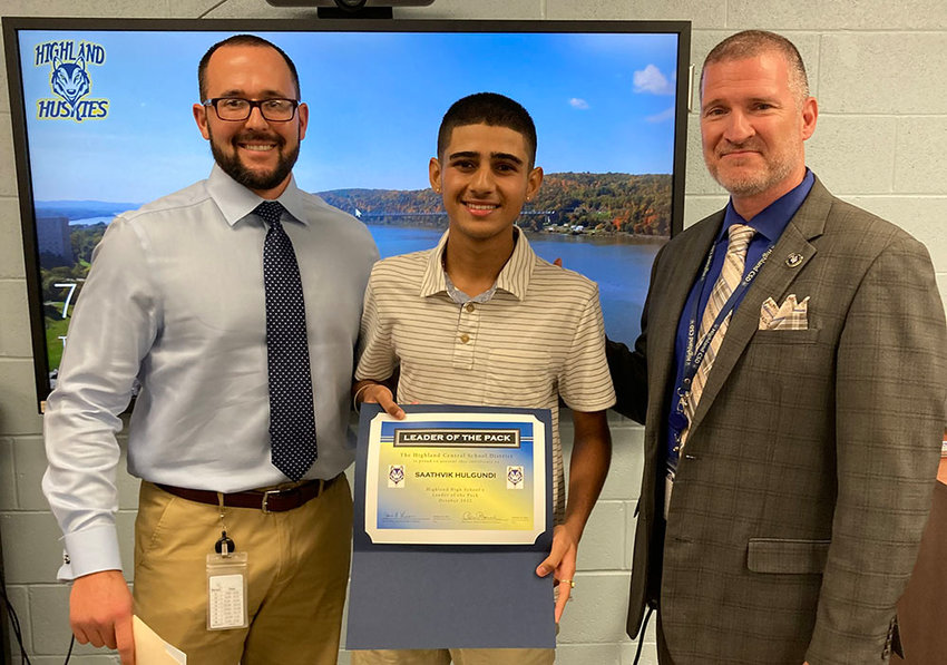 Saathvik Hulgundi, Highland High School&rsquo;s Leader of the Pack award recipient for October, poses with Assistant Principal Evan Kirsch (left) and Principal Kevin Murphy (right). Saathvik was presented with his certificate during a Highland Board of Education meeting on October 25.