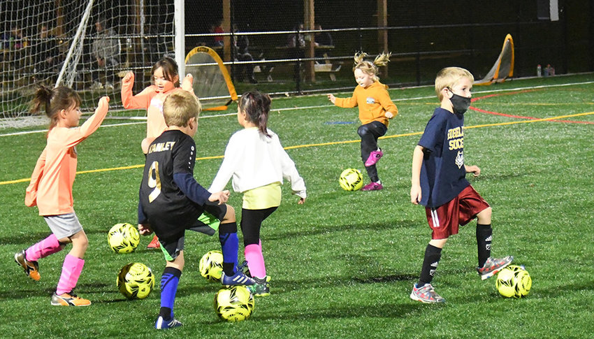 Youth soccer players practice their ball skills during a youth training session at Highland High School on Nov. 7.