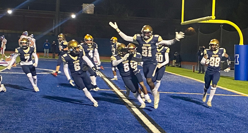 Newburgh&rsquo;s Deondre Johnson (81) and the Newburgh Free Academy football team celebrate their 26-20 win over Carmel in Saturday&rsquo;s NYSPHSAA Class AA regional championship football game at Faller Field in Middletown.