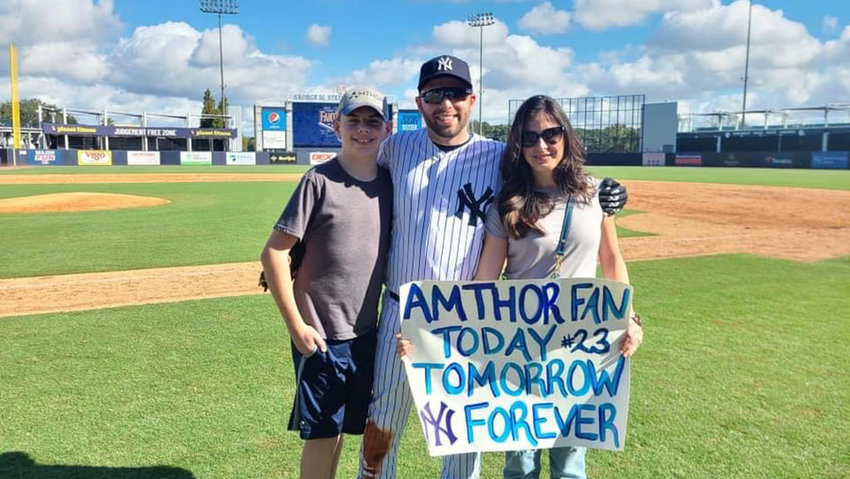 Brian Amthor with son William and wife Trisha at the New York Yankees&rsquo; Fantasy Camp in Tampa, FL.