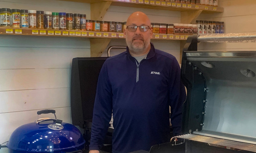 Michael Beck stands beside a grill in his newly opened Beck&rsquo;s Wallkill hardware and home and garden center in Wallkill.