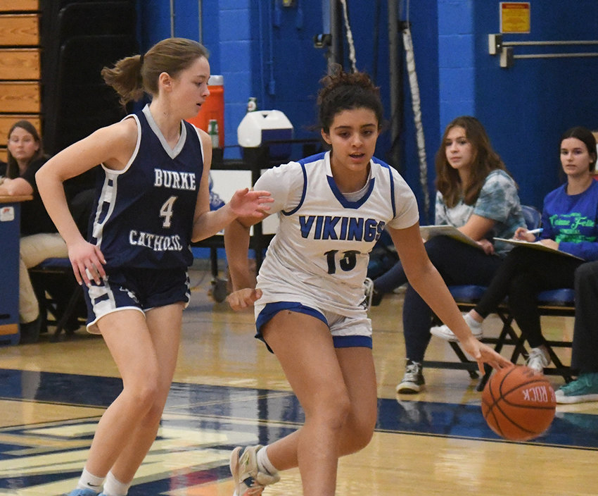 Valley Central&rsquo;s Isabella Santana drives the basketball as Burke Catholic&rsquo;s Michaela Byrons defends during Thursday&rsquo;s Corinne Feller Memorial Tournament consolation girls&rsquo; basketball game at Valley Central High School in Montgomery.