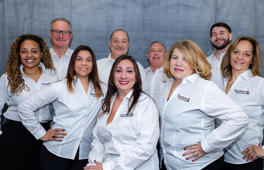 Back Row (from left to right): Neal Kolze, Cesar Landestoy, Jeffrey Lyons, Lucas Irace. Front Row (from left to right): Marie Savage, Carol Cruz, AnnMarie O&rsquo;Brien, Pamela DiMartino, Wendy Reinike.